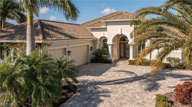 mediterranean / spanish-style home featuring a garage