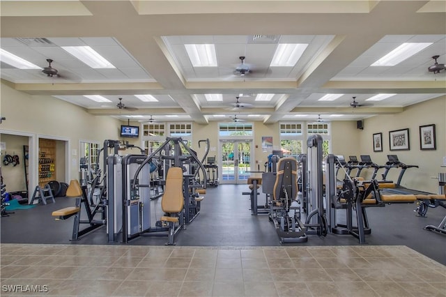 gym featuring coffered ceiling, french doors, and ceiling fan