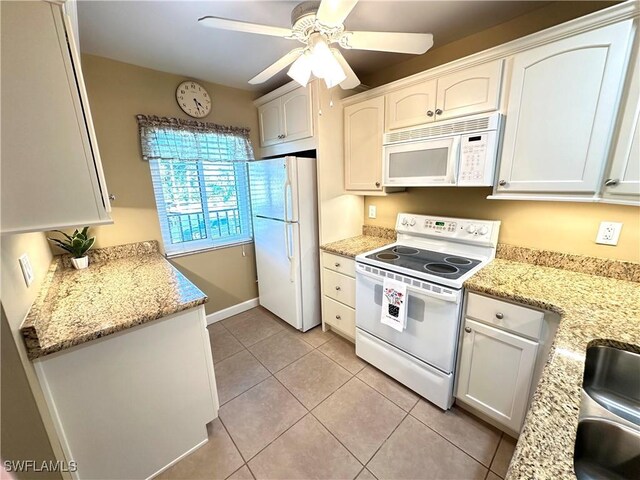 kitchen featuring white appliances, ceiling fan, light stone countertops, white cabinets, and light tile patterned flooring