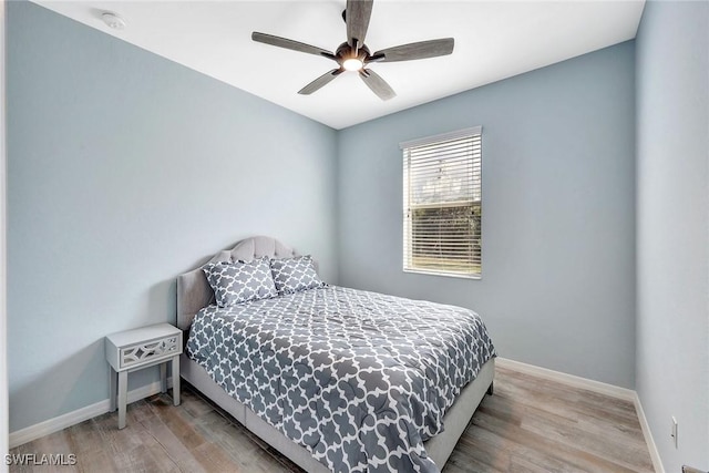 bedroom featuring ceiling fan and light wood-type flooring