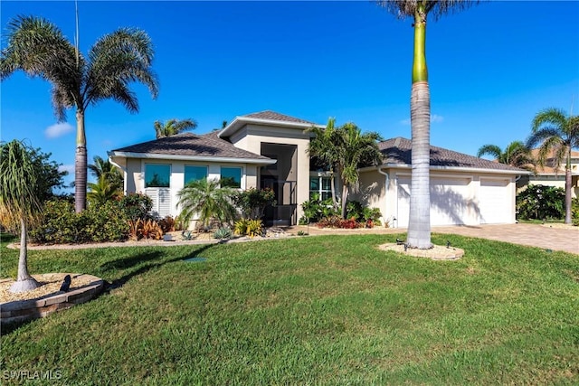 view of front of property featuring a garage and a front yard