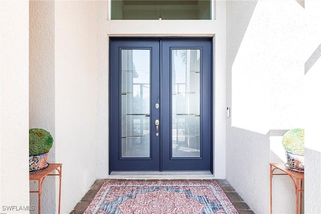 doorway to property featuring french doors