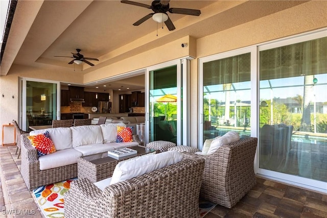 view of patio featuring ceiling fan and an outdoor hangout area