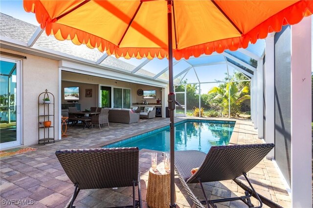 view of pool featuring a patio, a lanai, and an outdoor hangout area