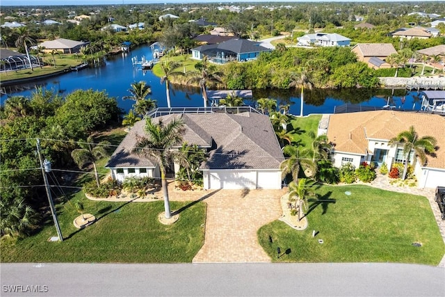 birds eye view of property featuring a water view