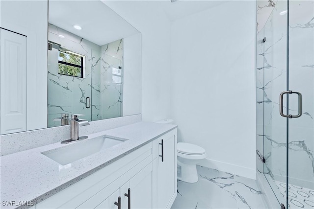 bathroom with vanity, an enclosed shower, and toilet