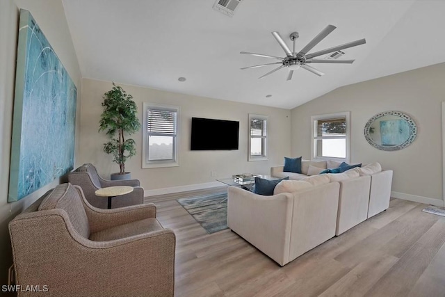 living room with lofted ceiling, light hardwood / wood-style floors, and ceiling fan