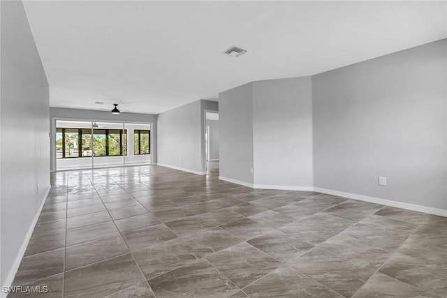 unfurnished living room featuring ceiling fan