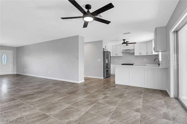 kitchen with white cabinets, exhaust hood, ceiling fan, kitchen peninsula, and stainless steel refrigerator with ice dispenser