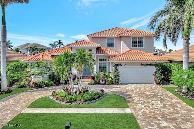 mediterranean / spanish-style house featuring a garage