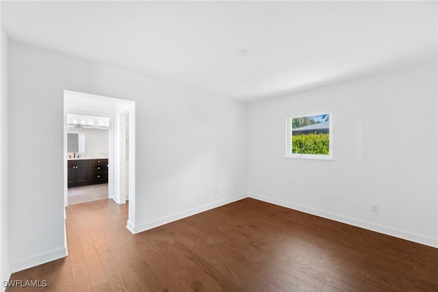 empty room with hardwood / wood-style flooring