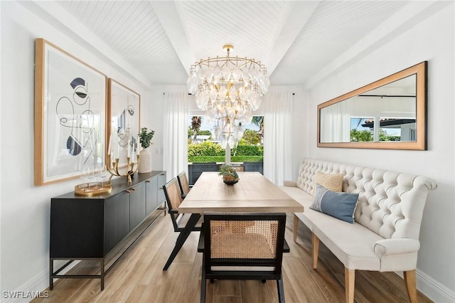 dining space featuring beamed ceiling, breakfast area, a wealth of natural light, and baseboards