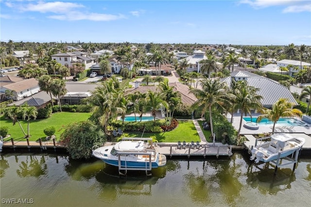 aerial view with a water view and a residential view