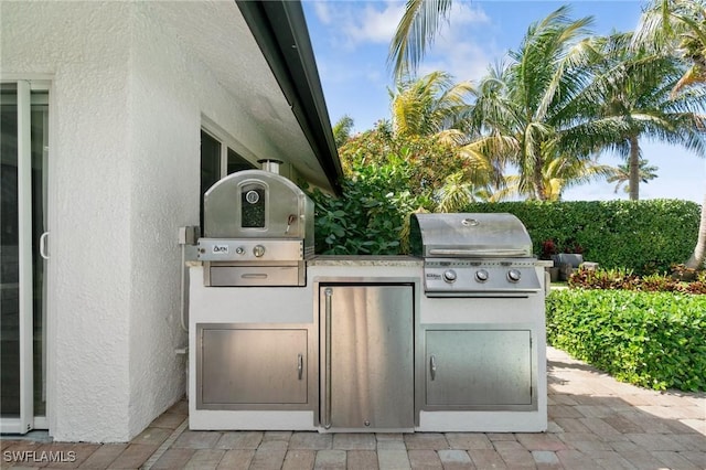 view of patio / terrace with area for grilling and an outdoor kitchen