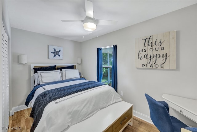 1533 San Marco Rd, Marco Island, FL 34145 - bedroom featuring baseboards, wood finished floors, and a ceiling fan