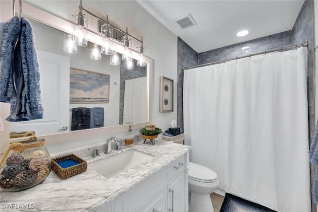 1533 San Marco Rd, Marco Island, FL 34145 - full bath with a shower with curtain, visible vents, toilet, and vanity
