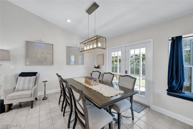 1533 San Marco Rd, Marco Island, FL 34145 - dining room featuring french doors, light tile patterned floors, baseboards, and lofted ceiling