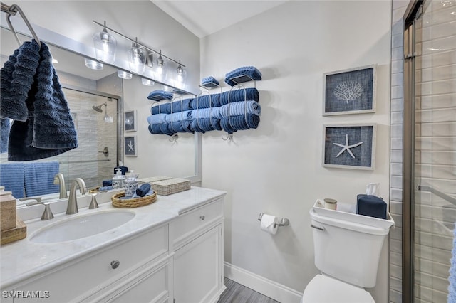 1533 San Marco Rd, Marco Island, FL 34145 - full bathroom with baseboards, vanity, toilet, and a shower stall
