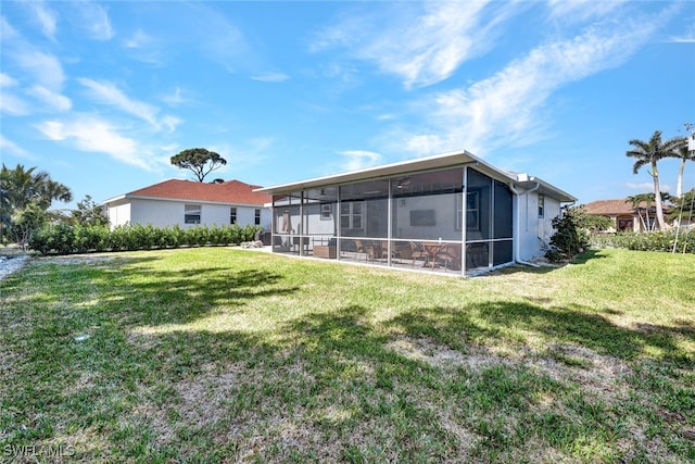 1533 San Marco Rd, Marco Island, FL 34145 - rear view of house featuring a sunroom and a yard