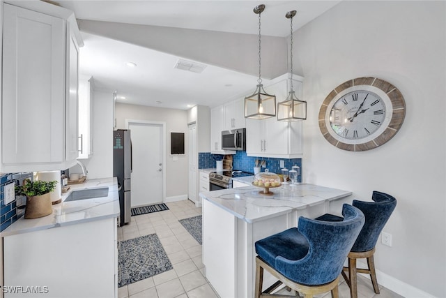 1533 San Marco Rd, Marco Island, FL 34145 - kitchen with a sink, light stone countertops, appliances with stainless steel finishes, visible vents, and white cabinets