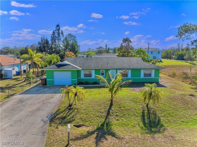 ranch-style home with a garage and a front lawn