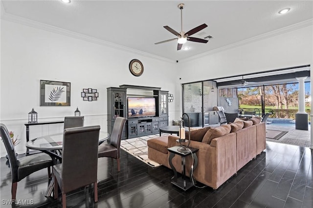 living room with ceiling fan and ornamental molding