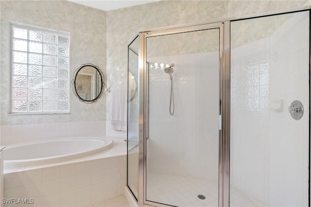 bathroom with separate shower and tub