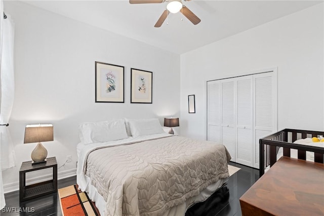 bedroom with ceiling fan, dark hardwood / wood-style flooring, and a closet