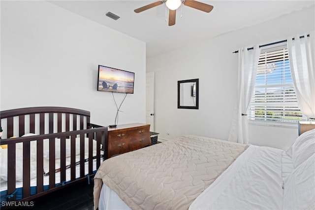 bedroom with hardwood / wood-style flooring and ceiling fan