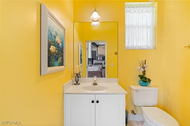 bathroom with vanity and toilet