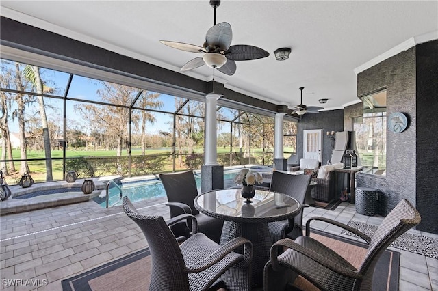 view of patio / terrace featuring a lanai and ceiling fan