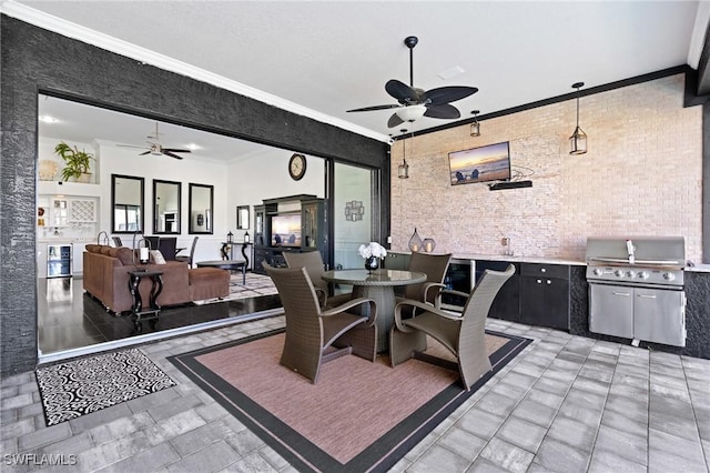 view of patio with exterior kitchen and ceiling fan