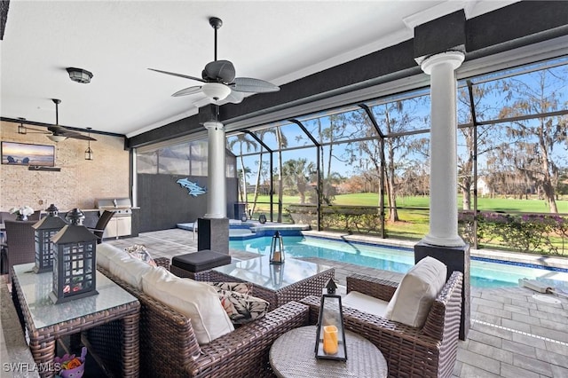 view of patio featuring a lanai, an outdoor hangout area, and ceiling fan