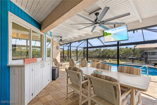 view of patio / terrace featuring ceiling fan and glass enclosure