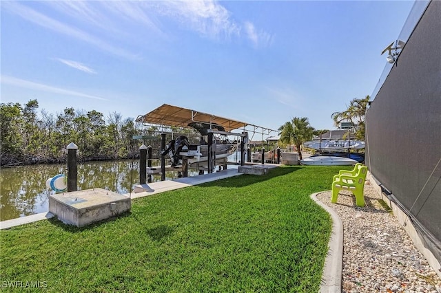 dock area with a water view and a yard