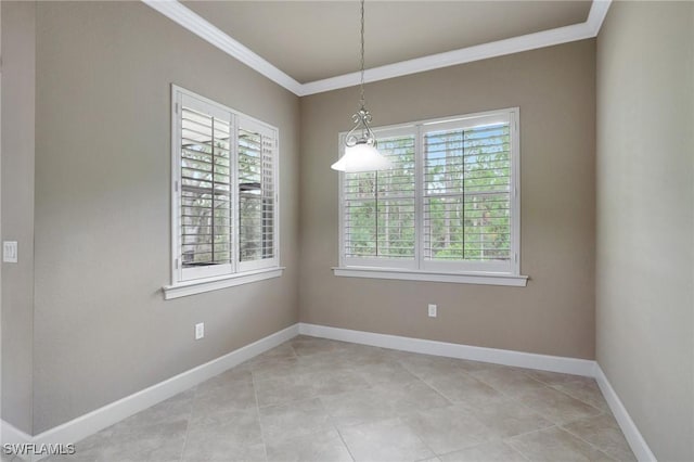 unfurnished room with crown molding, plenty of natural light, and light tile patterned floors