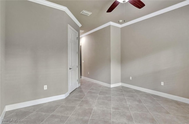 empty room with crown molding, ceiling fan, and light tile patterned floors