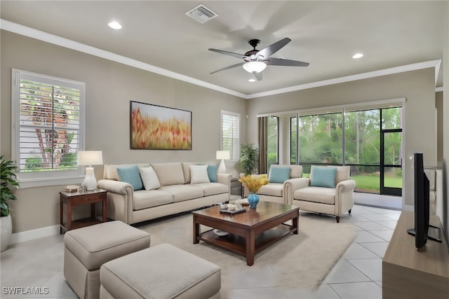 living room featuring light tile patterned floors, crown molding, and ceiling fan