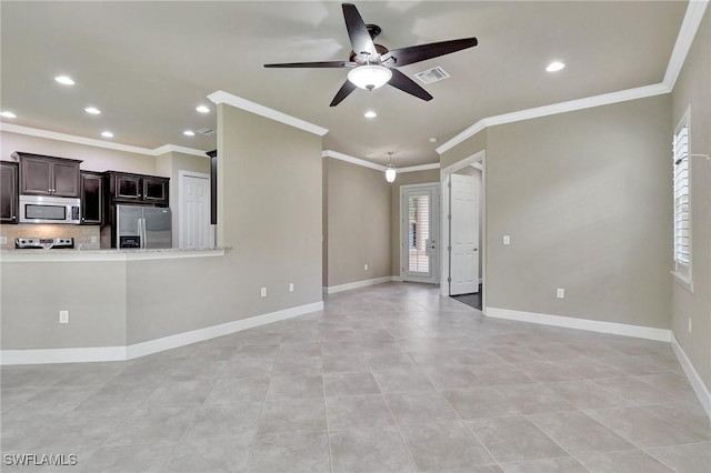 unfurnished living room featuring ornamental molding, plenty of natural light, and ceiling fan