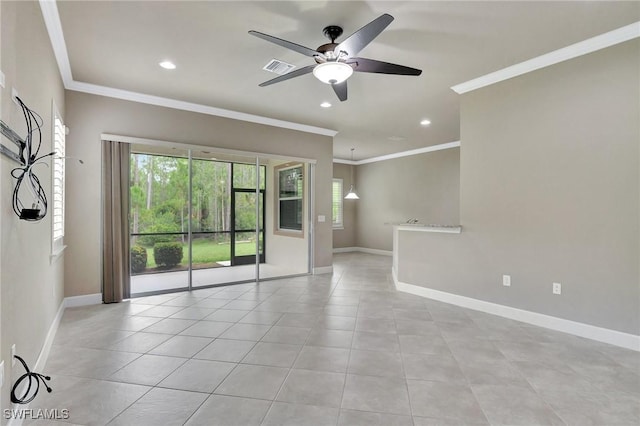 tiled spare room featuring crown molding and ceiling fan