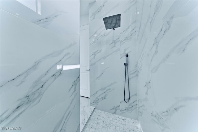 interior details with a tile shower