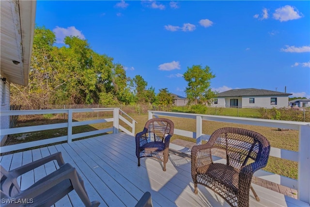 wooden terrace with a yard