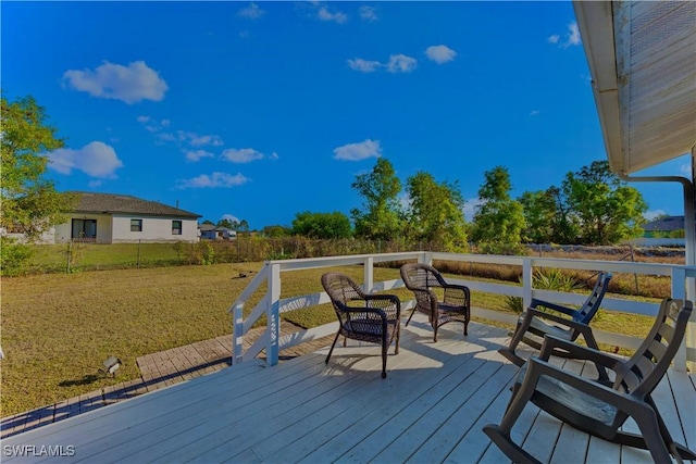 wooden deck with a yard