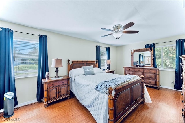 bedroom featuring hardwood / wood-style flooring and ceiling fan