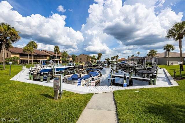 dock area with a water view and a lawn