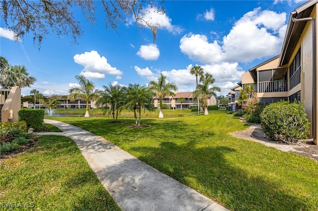 view of property's community featuring a yard