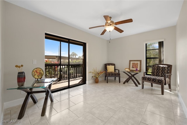 sitting room featuring light tile patterned floors and ceiling fan