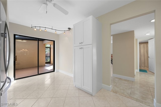 interior space featuring ceiling fan