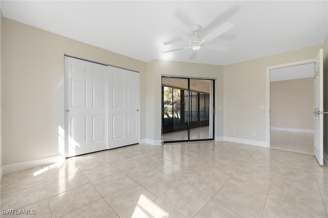 unfurnished bedroom featuring ceiling fan and light tile patterned floors