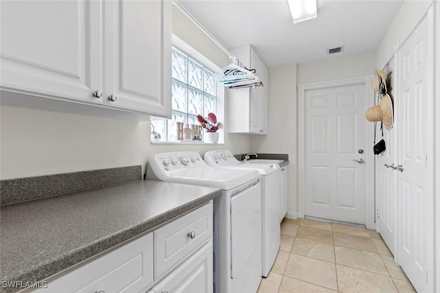 7912 Umberto Ct, Naples, FL 34114 - clothes washing area with cabinets, light tile patterned floors, and washing machine and clothes dryer